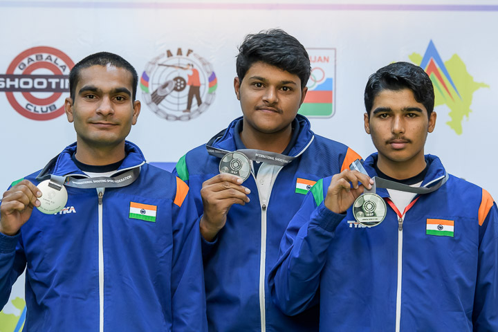 Silver medallist team of India pose with their medals after Junior Men's 10m Air Pistol.
